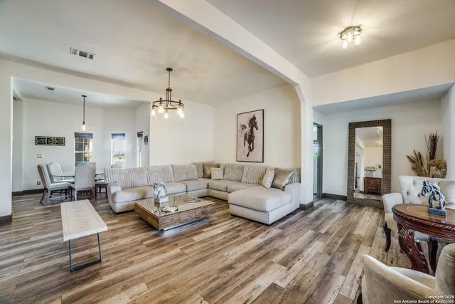 a living room with furniture or couch and a dining table