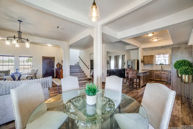a view of a dining room with furniture window and wooden floor