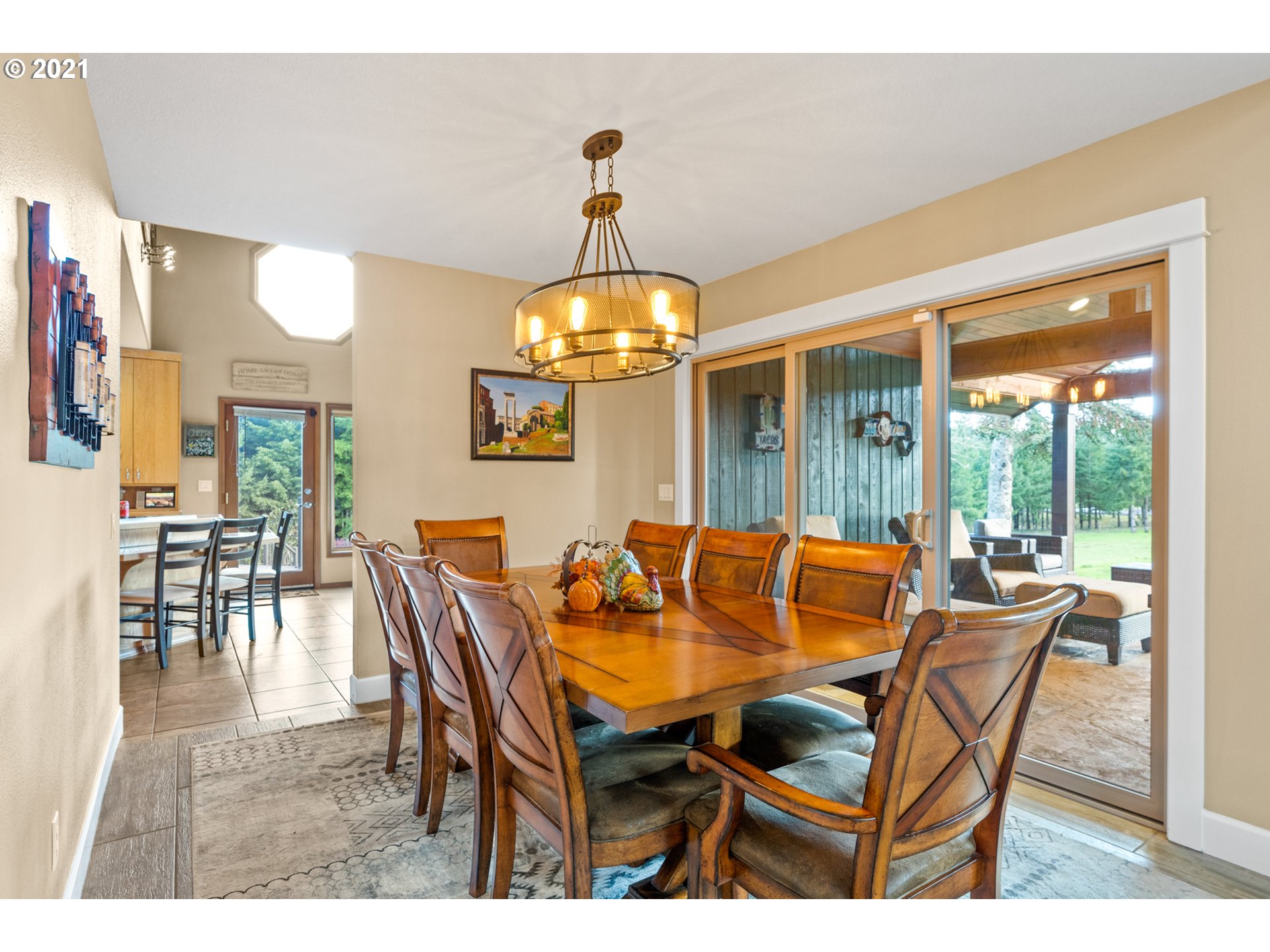 15695 South Carus Road Oregon City, OR 97045 - Photo 13 of 32 a dining room with furniture window and wooden floor