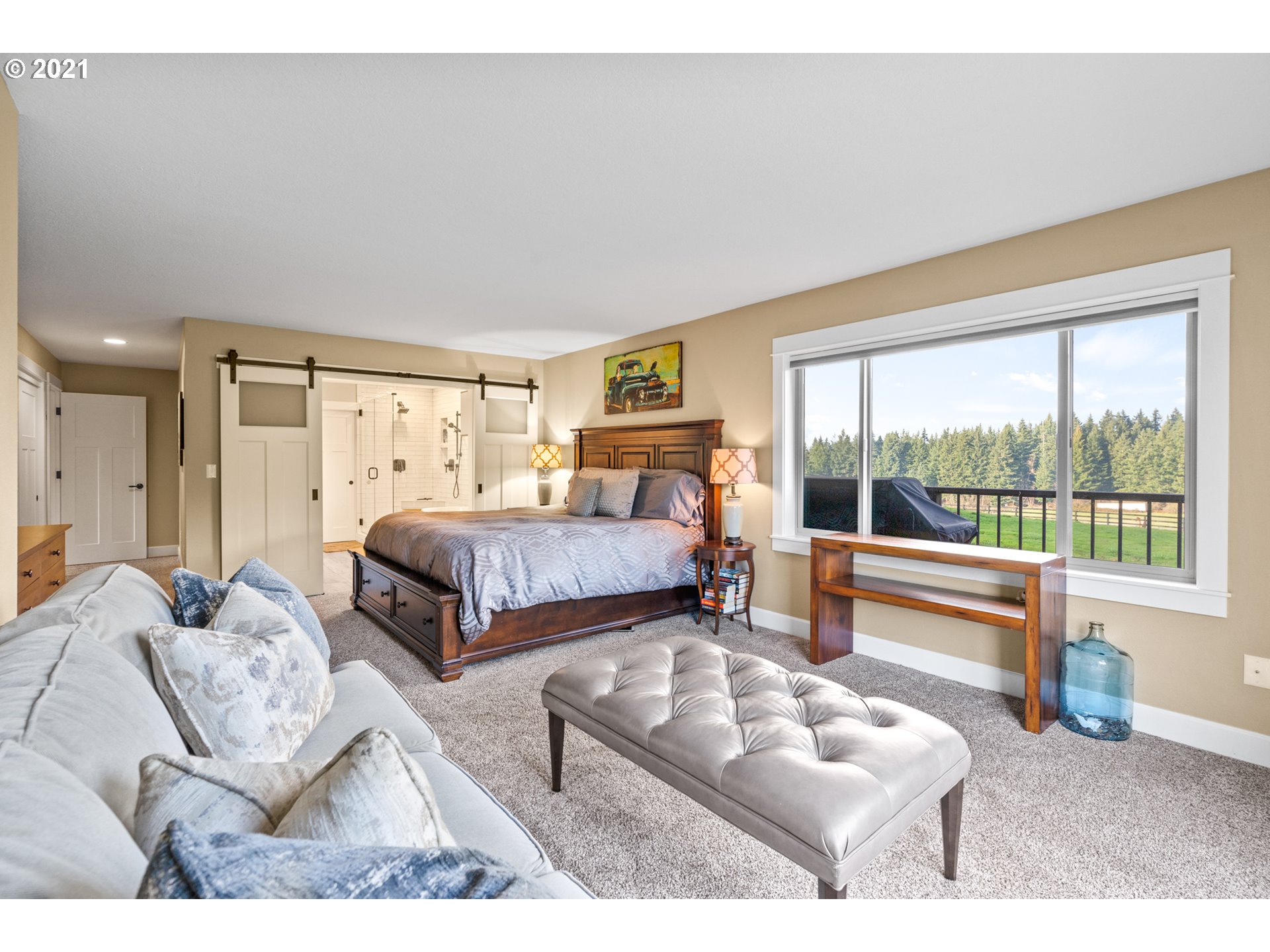 15695 South Carus Road Oregon City, OR 97045 - Photo 15 of 32 a bedroom with furniture and a large window