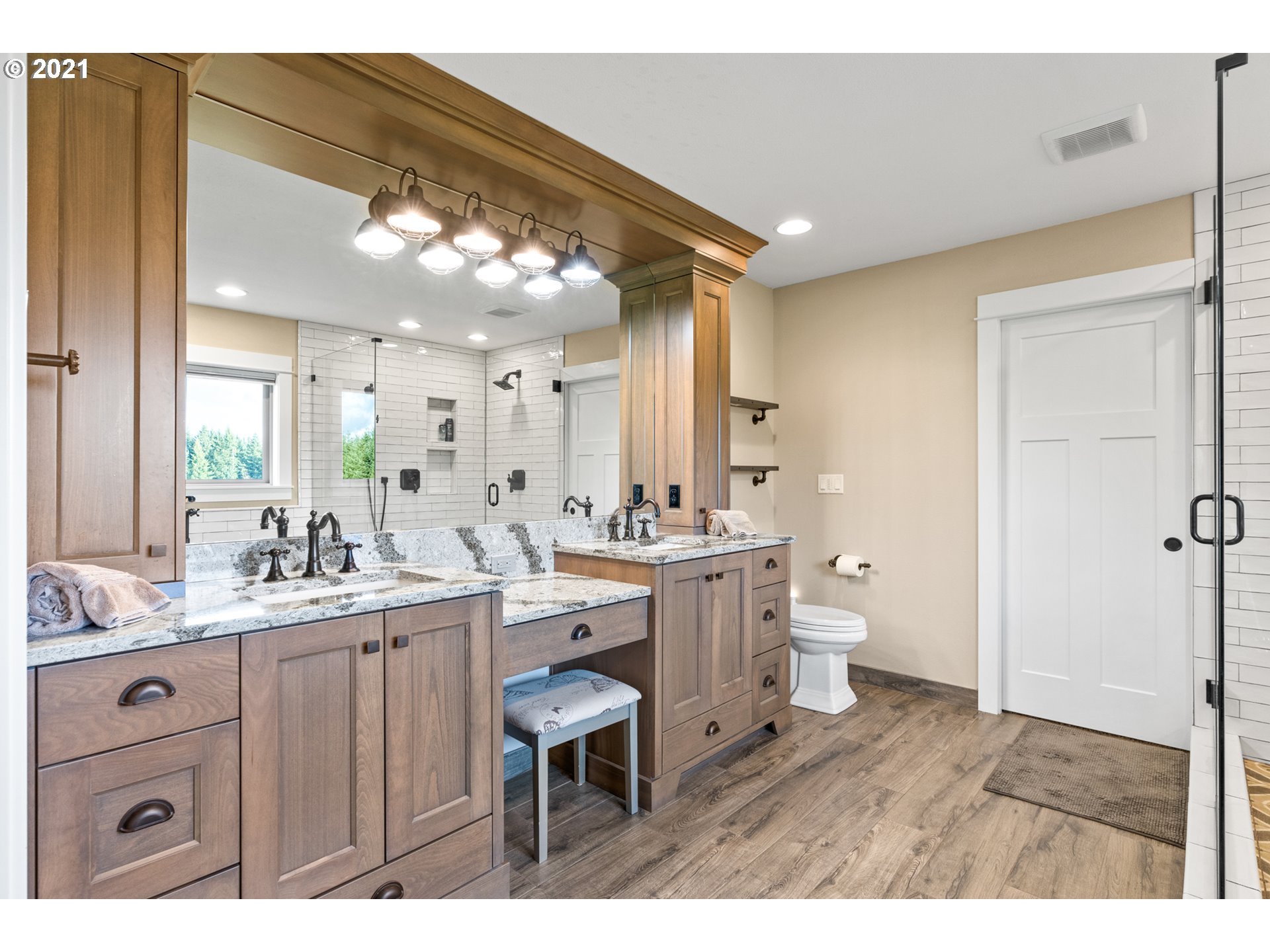 15695 South Carus Road Oregon City, OR 97045 - Photo 16 of 32 a bathroom with a sink mirror and a toilet