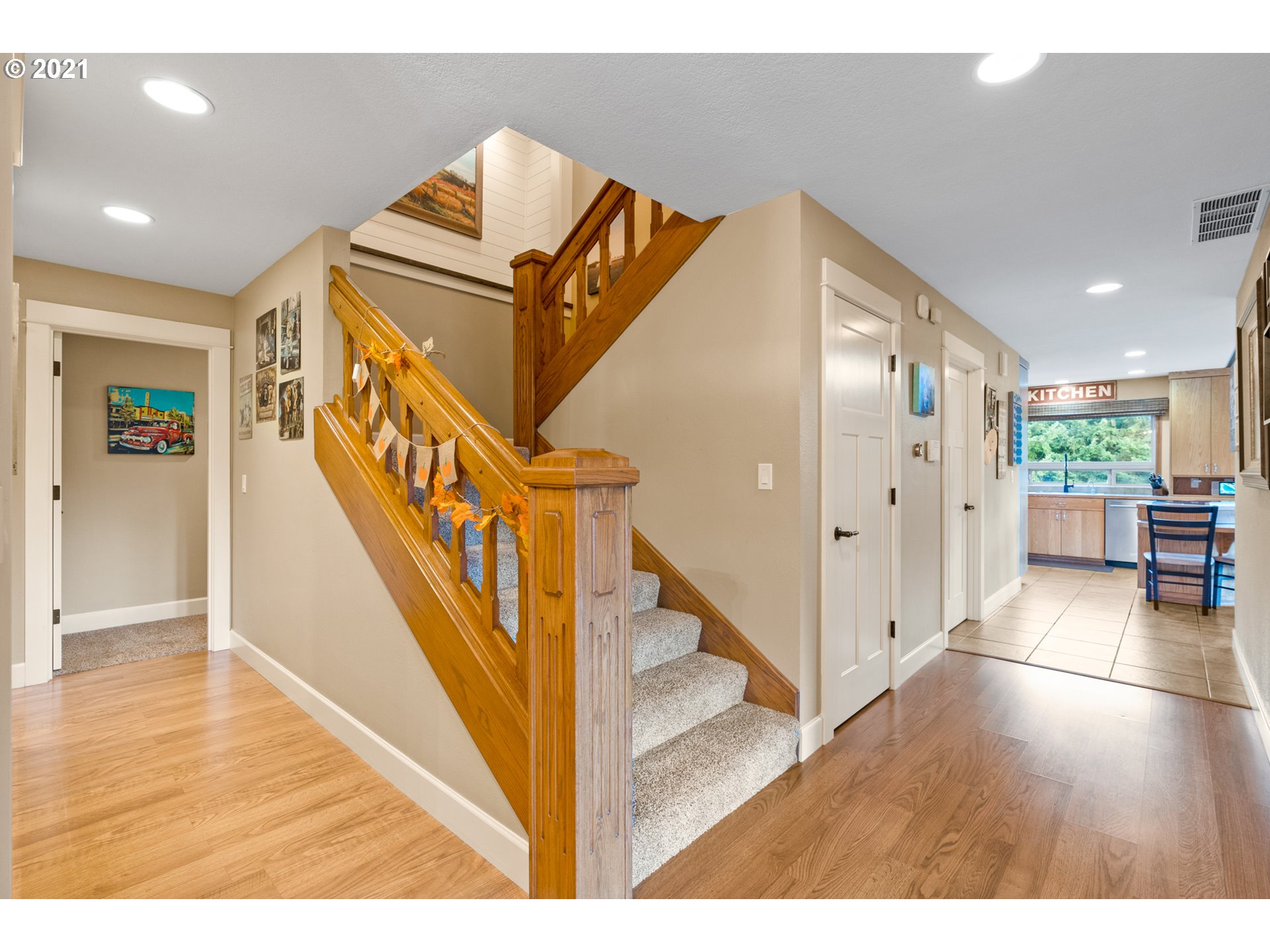 15695 South Carus Road Oregon City, OR 97045 - Photo 3 of 32 a view of a livingroom with wooden floor and stairs