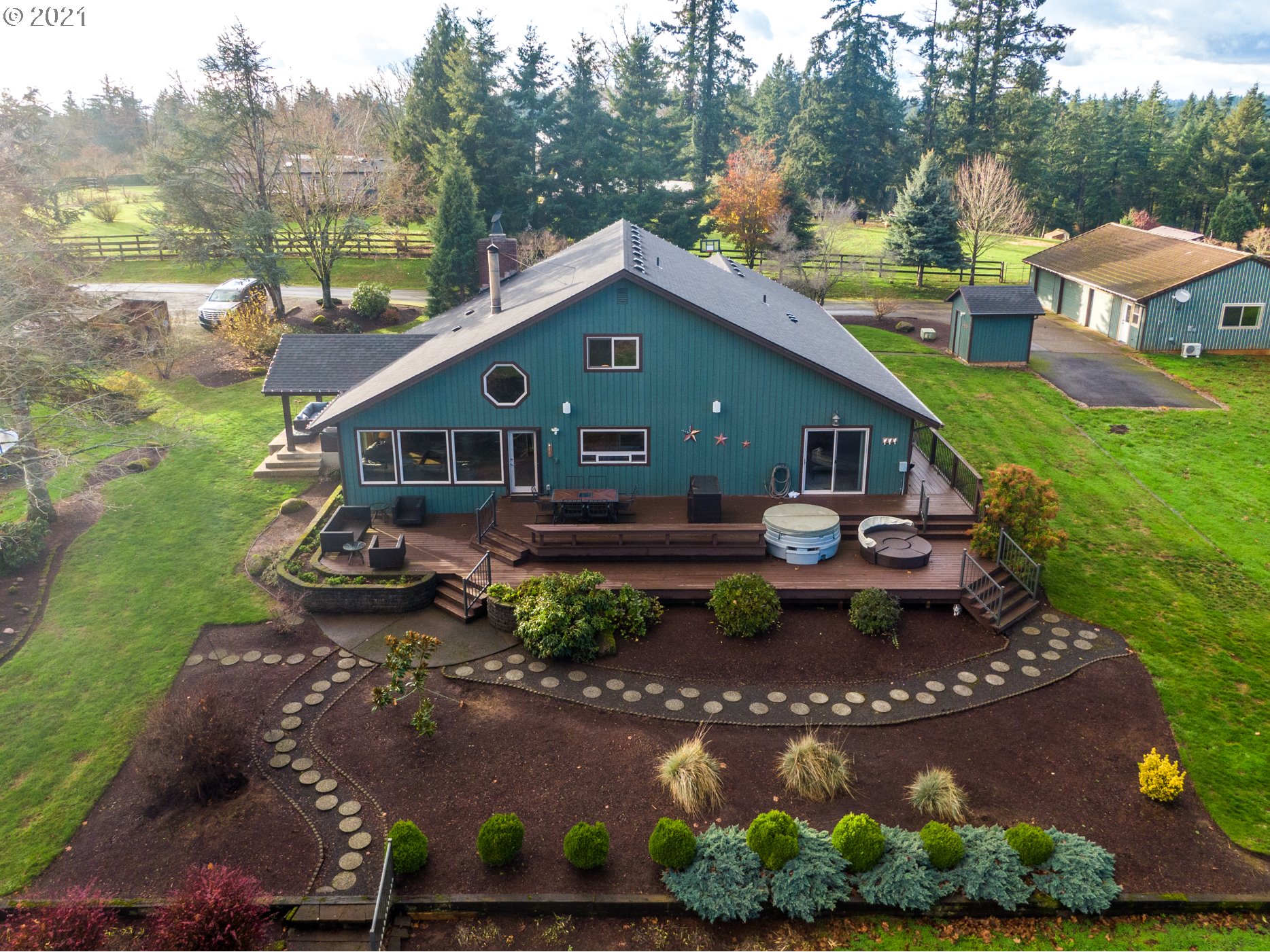 15695 South Carus Road Oregon City, OR 97045 - Photo 22 of 32 a front view of a house with garden