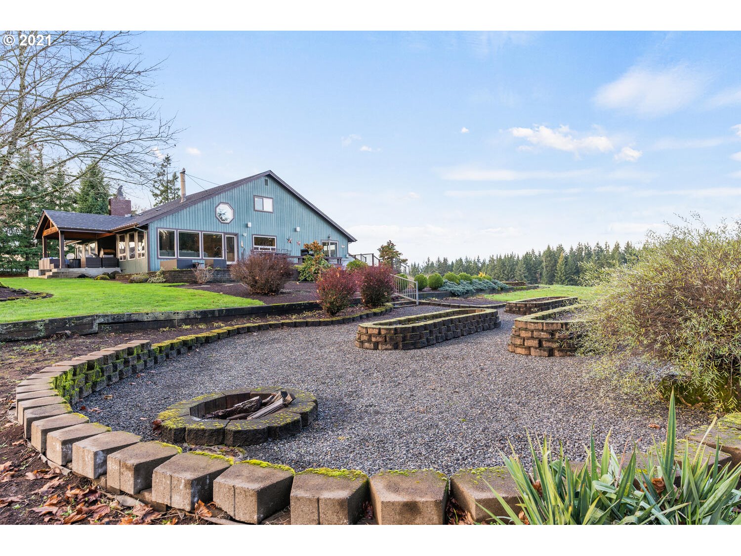 15695 South Carus Road Oregon City, OR 97045 - Photo 25 of 32 a backyard of a house with wooden floor