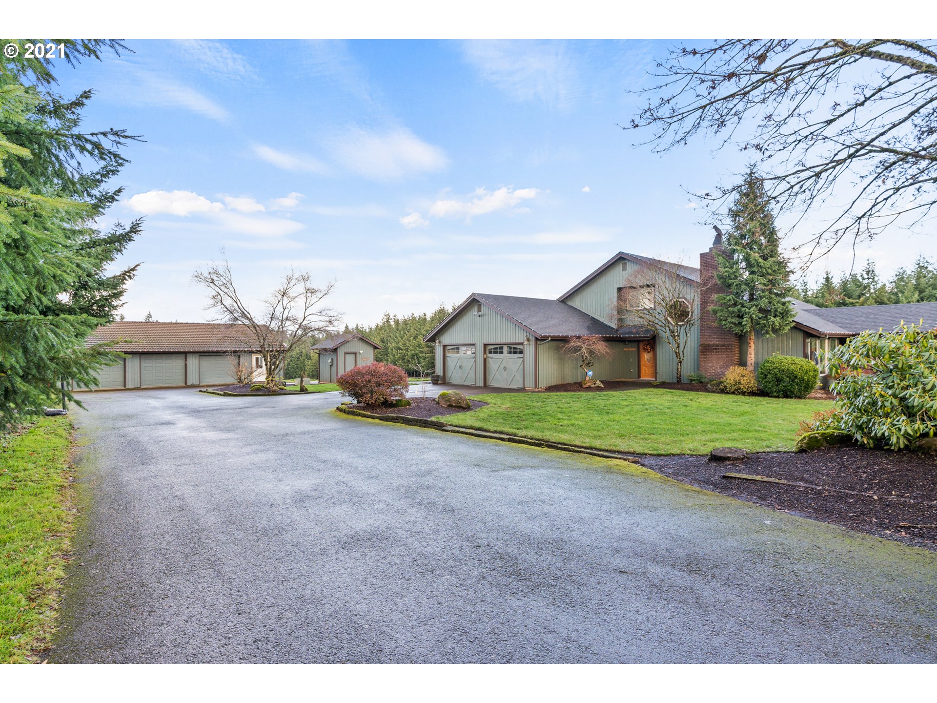 15695 South Carus Road Oregon City, OR 97045 - Photo 26 of 32 a view of a big house with a big yard and large trees