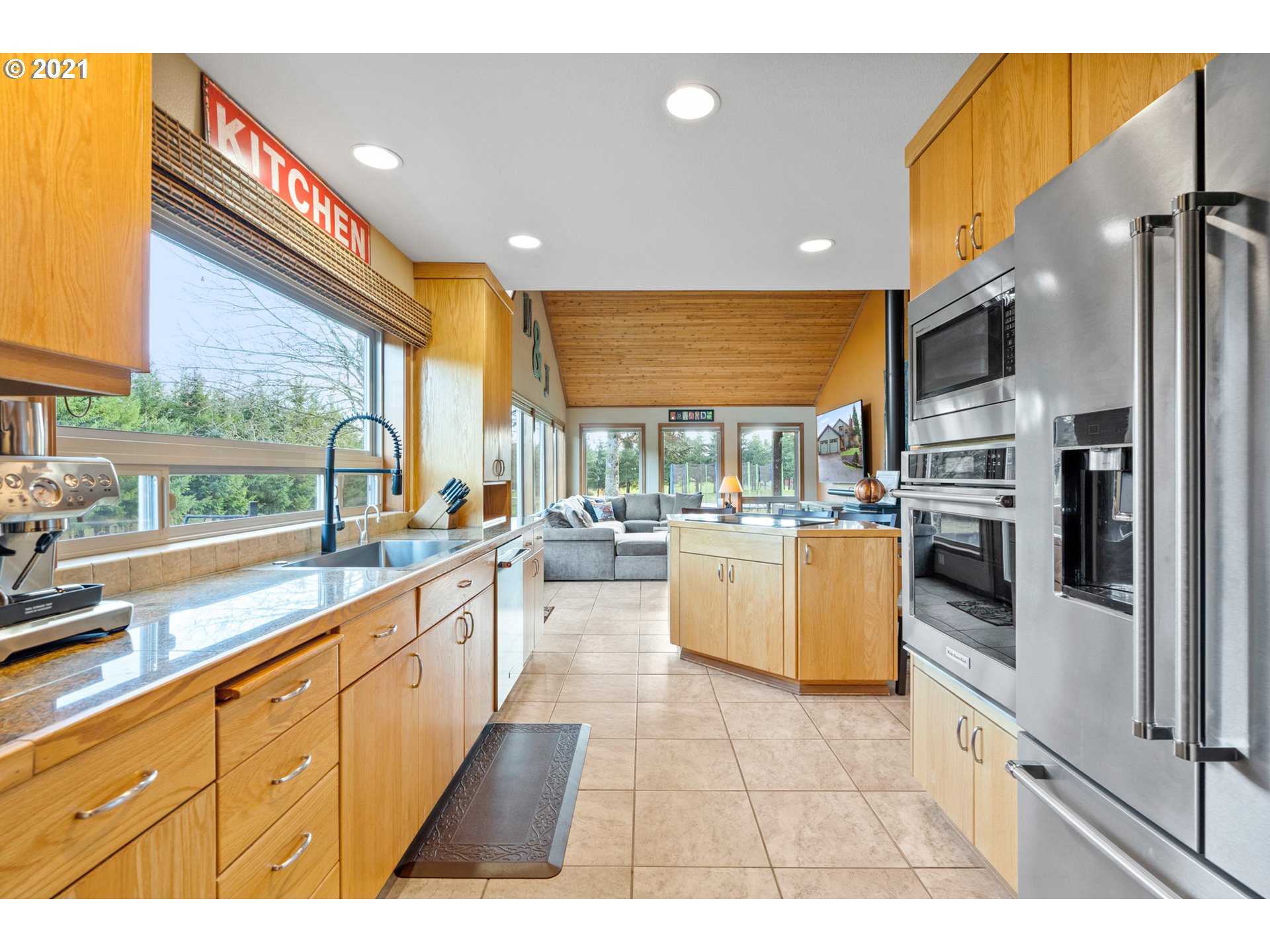 15695 South Carus Road Oregon City, OR 97045 - Photo 6 of 32 a kitchen with stainless steel appliances kitchen island granite countertop a large kitchen counter top a stove and a sink