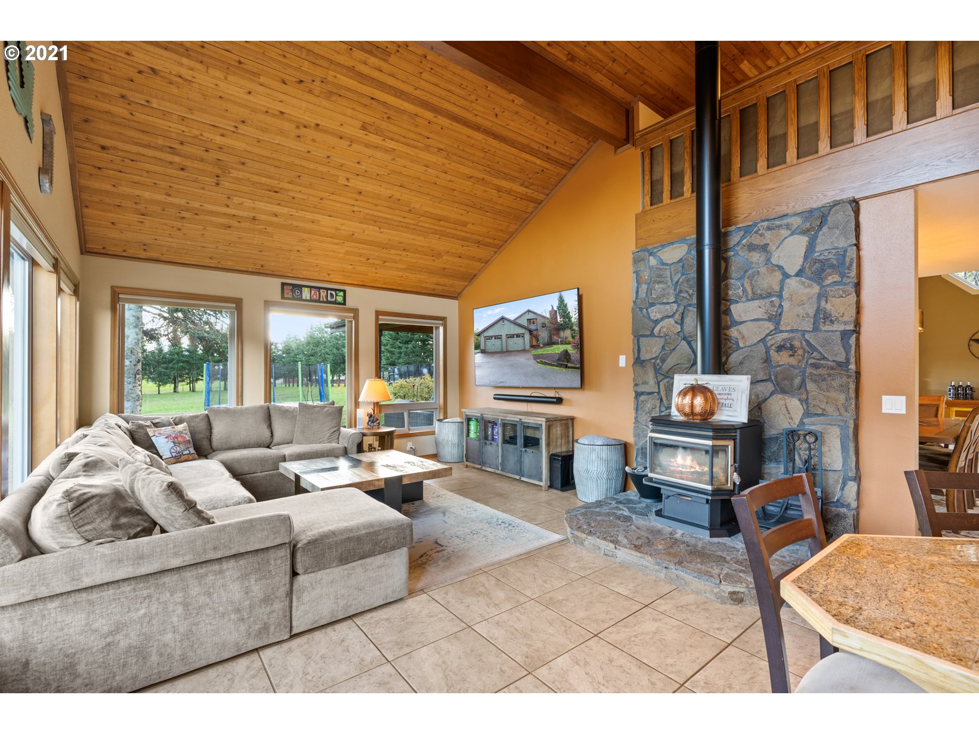 15695 South Carus Road Oregon City, OR 97045 - Photo 8 of 32 a living room with furniture a fireplace and a table