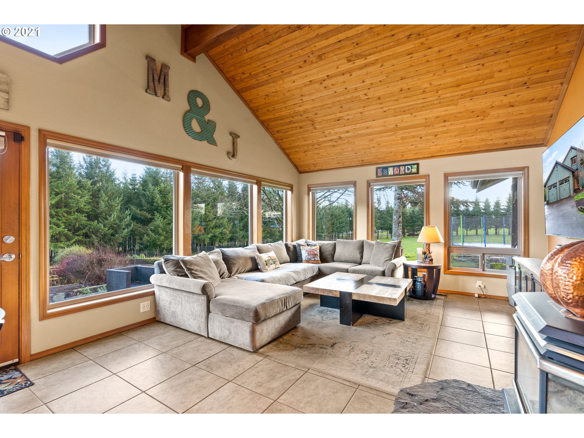 15695 South Carus Road Oregon City, OR 97045 - Photo 9 of 32 a living room with furniture and large windows