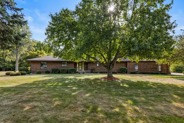 a tall house with a yard