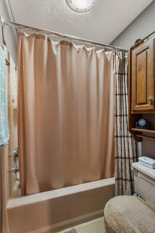 a bedroom with a bed and flat screen tv