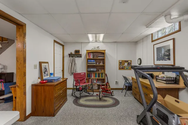 a view of swimming pool with garden and furniture
