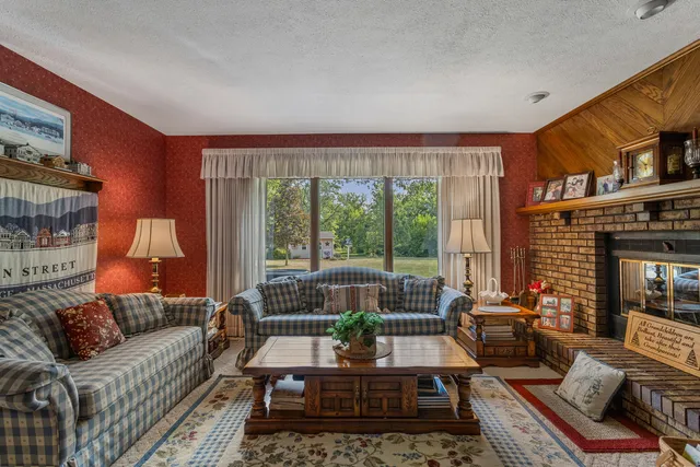 a view of a dining room with furniture and chandelier