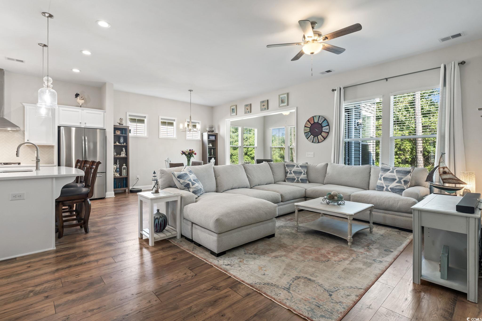 502 Bumble Circle Murrells Inlet, SC 29576 - Photo 11 of 39 Living room featuring sink, ceiling fan with notab