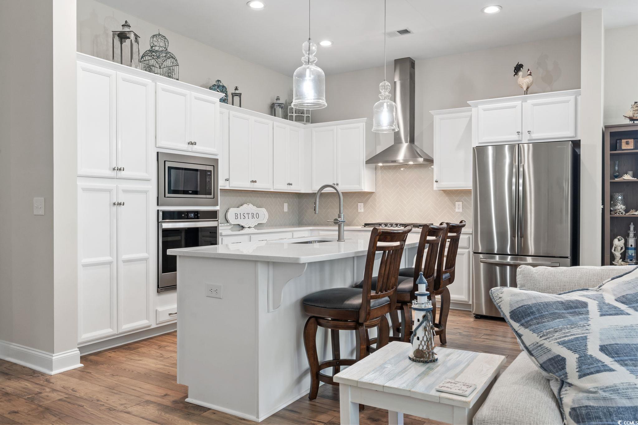 502 Bumble Circle Murrells Inlet, SC 29576 - Photo 12 of 39 Kitchen with a kitchen island with sink, stainless