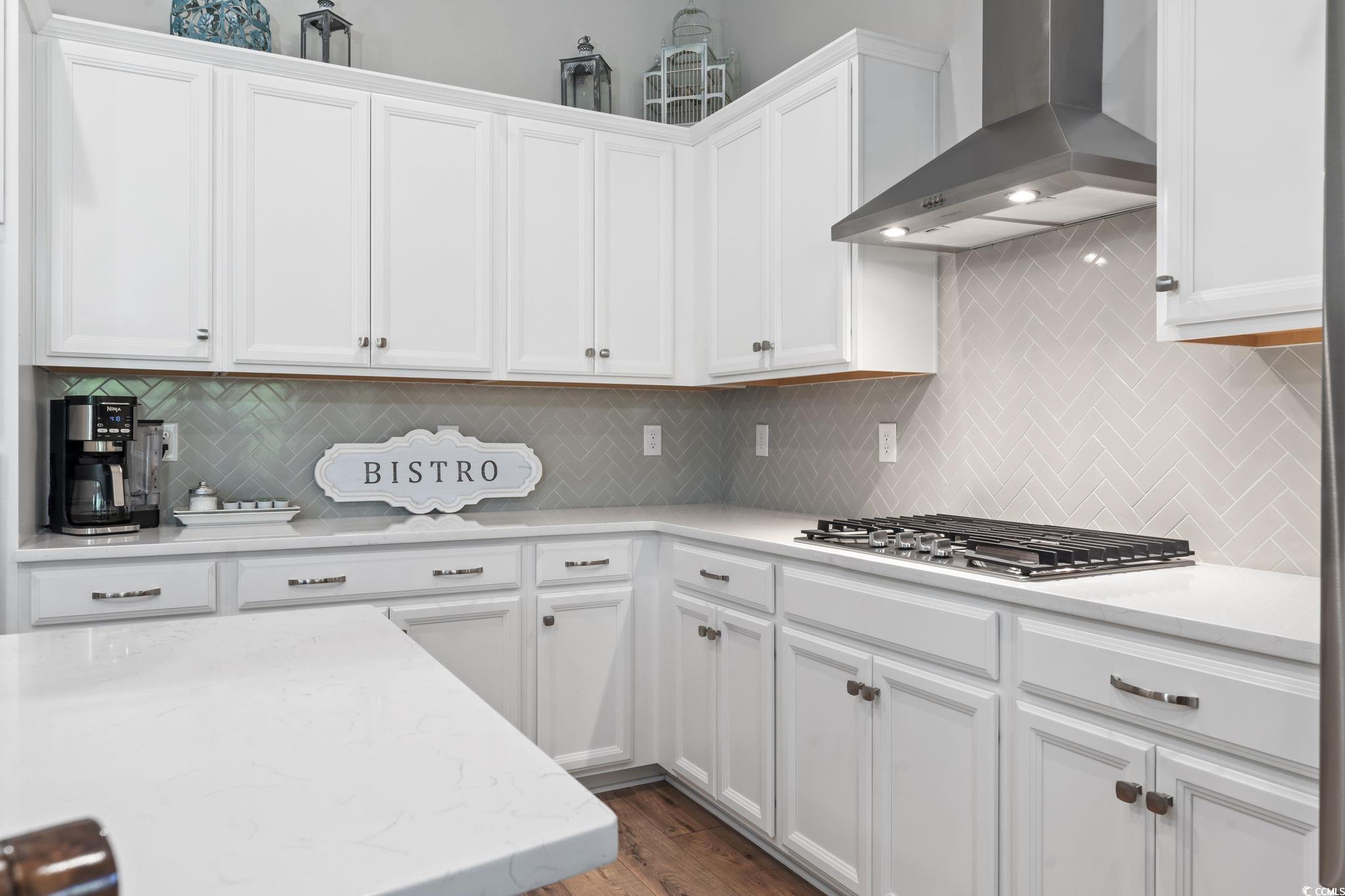 502 Bumble Circle Murrells Inlet, SC 29576 - Photo 15 of 39 Kitchen with wall chimney exhaust hood, dark wood-