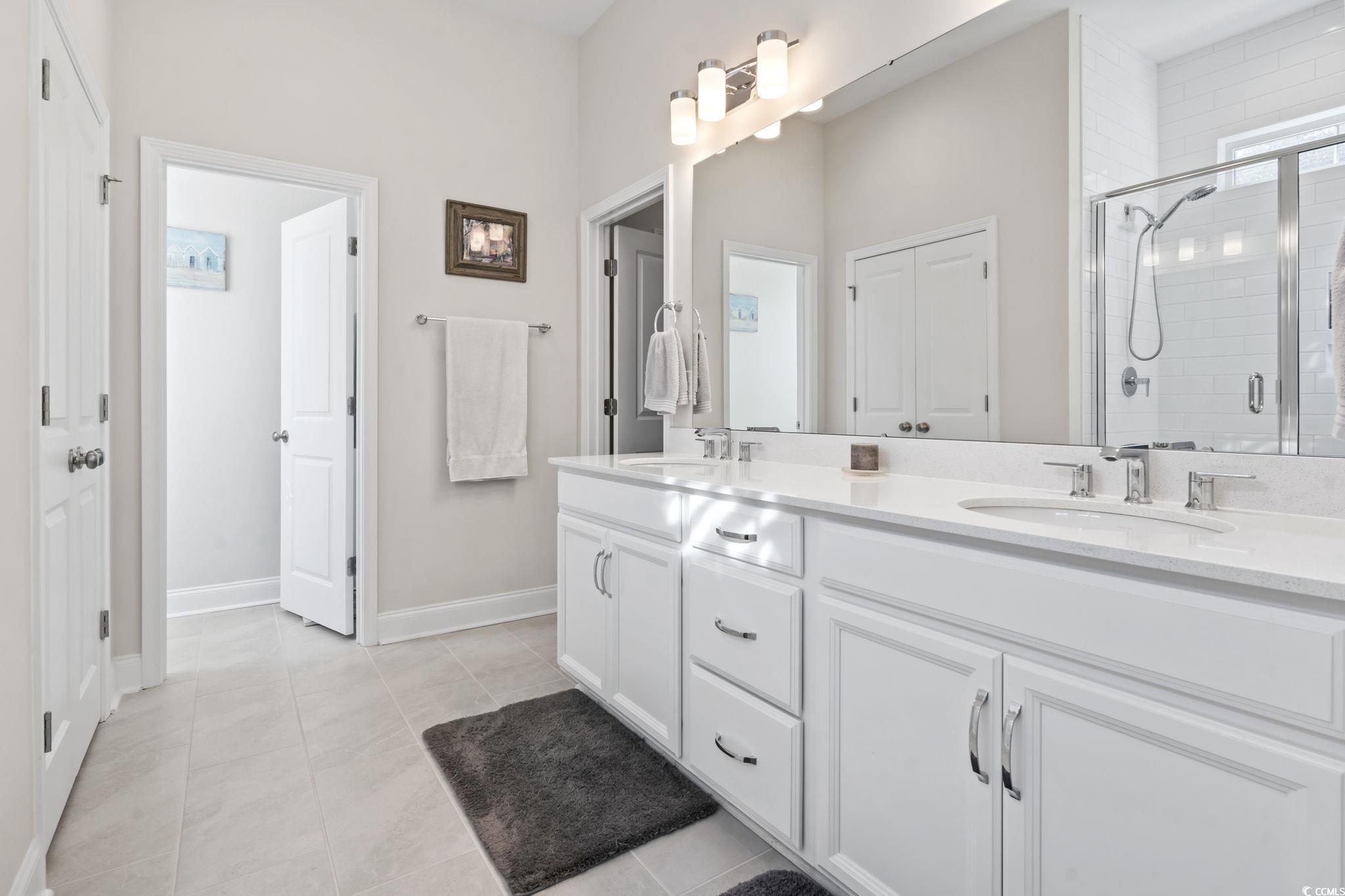 502 Bumble Circle Murrells Inlet, SC 29576 - Photo 22 of 39 Bathroom with vanity, tile patterned flooring, and