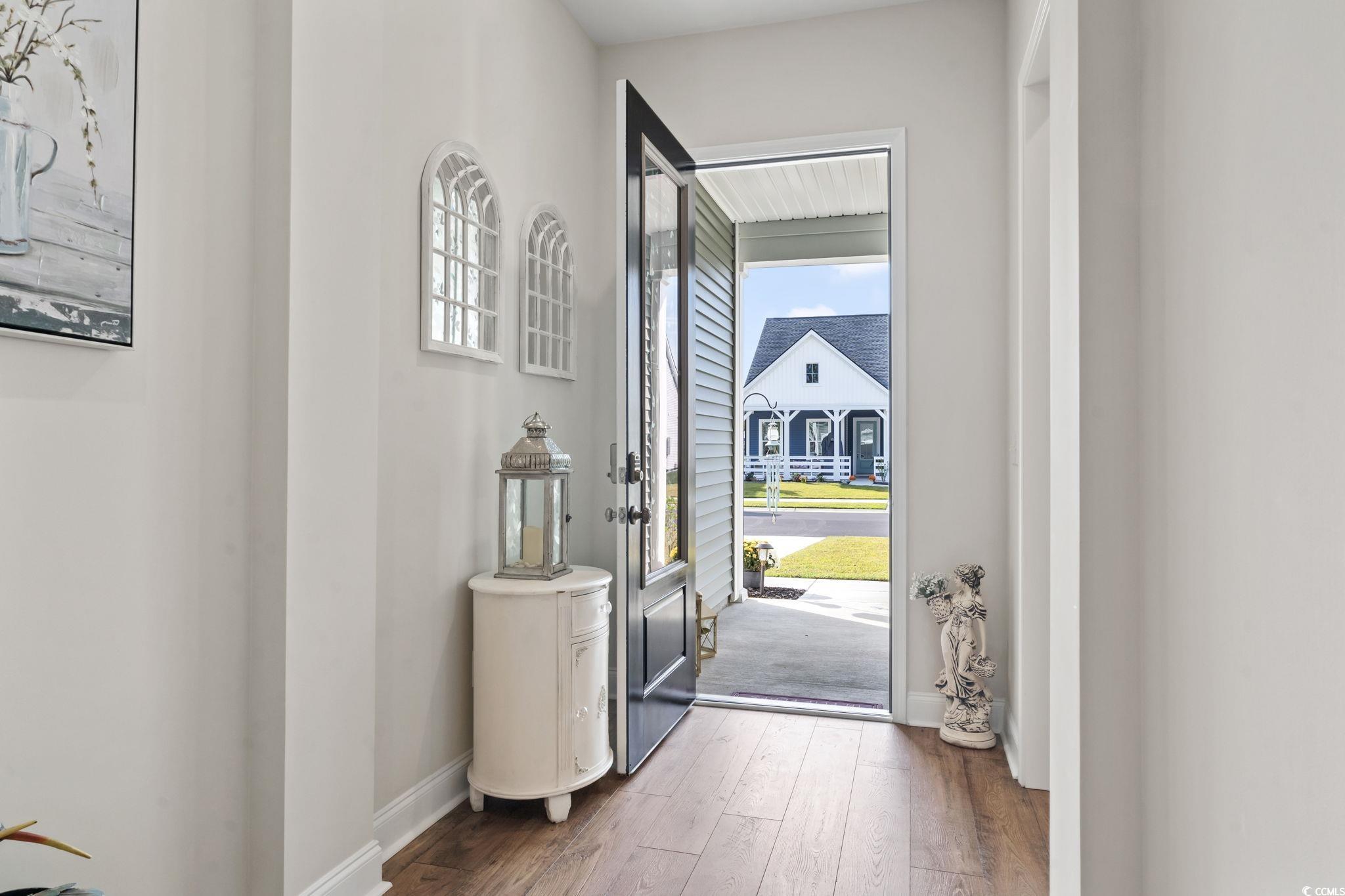 502 Bumble Circle Murrells Inlet, SC 29576 - Photo 3 of 39 Interior space with dark hardwood / wood-style flo