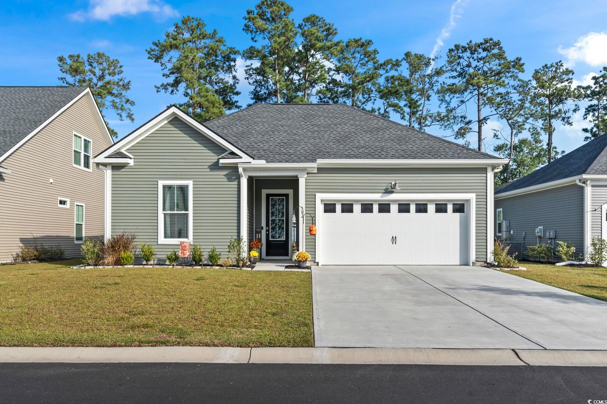 502 Bumble Circle Murrells Inlet, SC 29576 - Photo 35 of 39 Front facade featuring a front yard and a garage