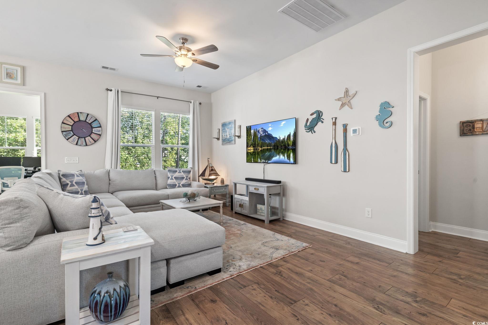 502 Bumble Circle Murrells Inlet, SC 29576 - Photo 10 of 39 Living room featuring a healthy amount of sunlight