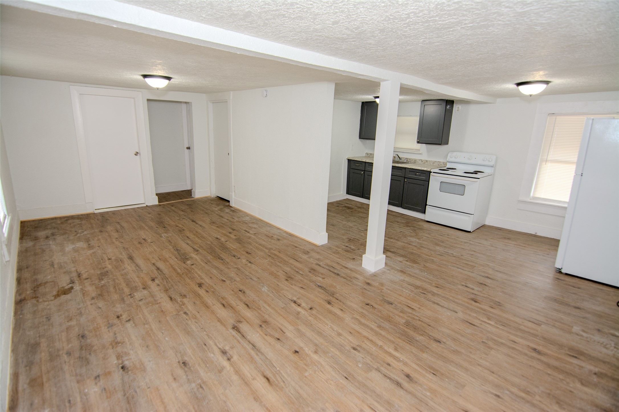 3307 Broadway Street, Unit 2 Houston, TX 77017 - Photo 2 of 8 a view of kitchen with microwave and wooden floor