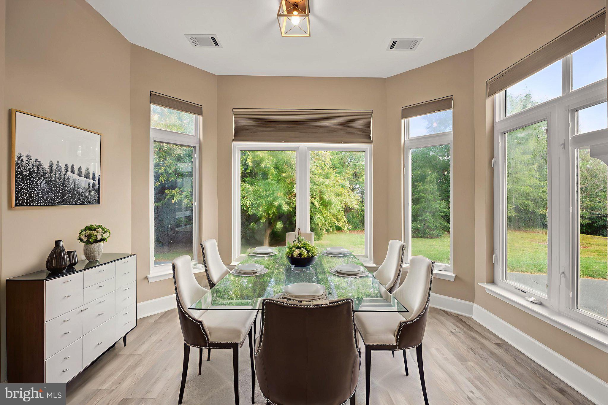 1621 Ladue Court, Unit 105 Woodbridge, VA 22191 - Photo 11 of 60 a dining room with furniture window and wooden floor