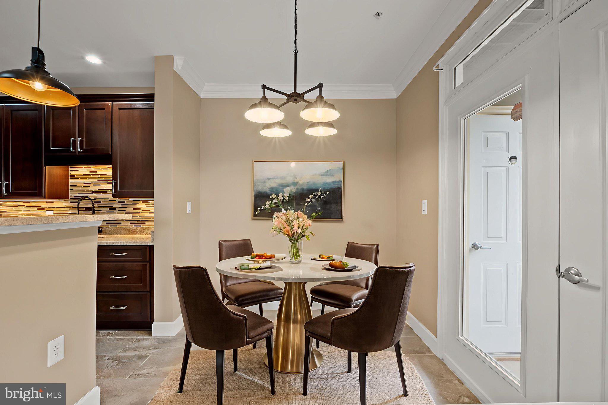 1621 Ladue Court, Unit 105 Woodbridge, VA 22191 - Photo 19 of 60 a dining room with furniture a chandelier and window