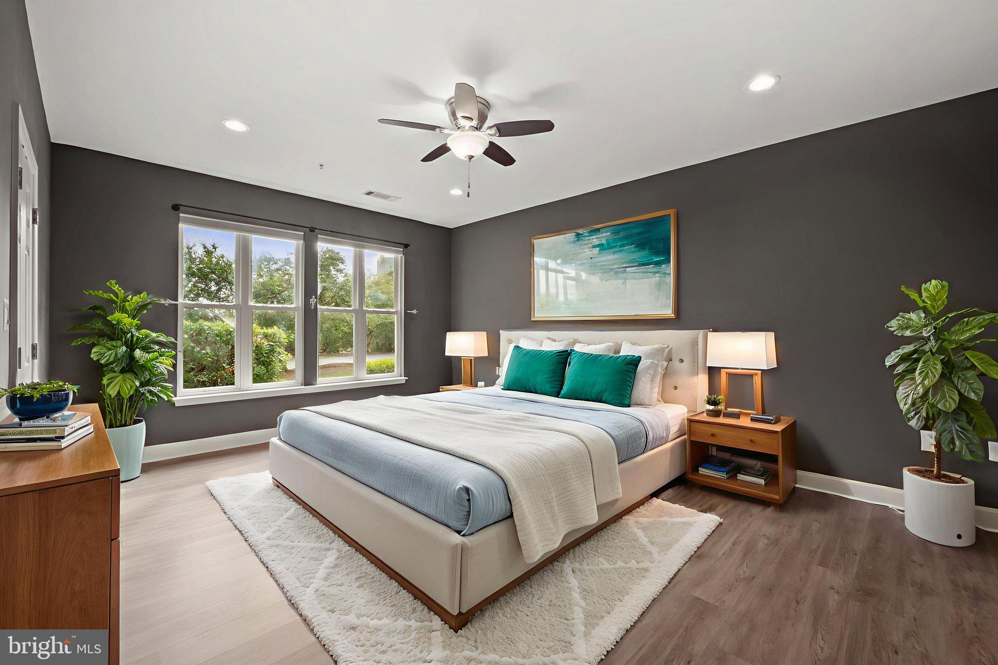 1621 Ladue Court, Unit 105 Woodbridge, VA 22191 - Photo 21 of 60 a bedroom with a large bed and a potted plant