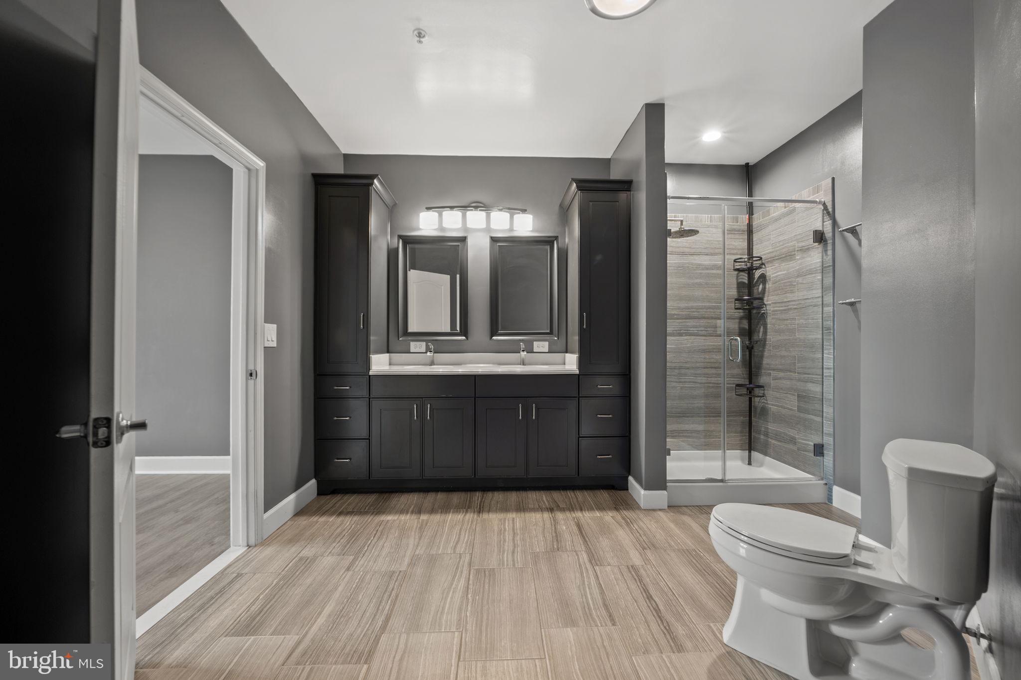 1621 Ladue Court, Unit 105 Woodbridge, VA 22191 - Photo 25 of 60 a bathroom with a sink a toilet and shower