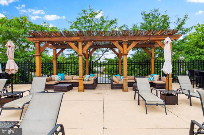 1621 Ladue Court, Unit 105 Woodbridge, VA 22191 - Photo 46 of 60 an outdoor sitting area with furniture and garden view