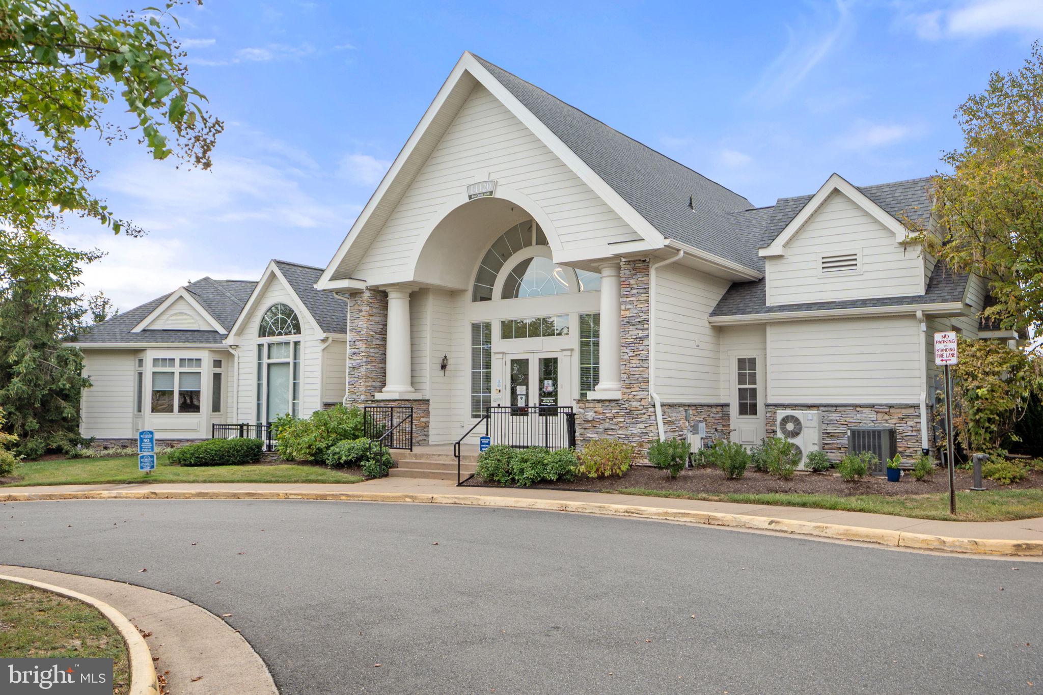 1621 Ladue Court, Unit 105 Woodbridge, VA 22191 - Photo 47 of 60 a front view of a house with a yard