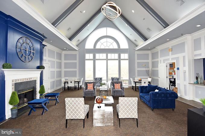 1621 Ladue Court, Unit 105 Woodbridge, VA 22191 - Photo 48 of 60 a living room with furniture a fireplace and large windows