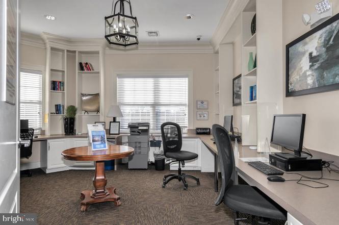 1621 Ladue Court, Unit 105 Woodbridge, VA 22191 - Photo 58 of 60 a view of a workspace with furniture and a window