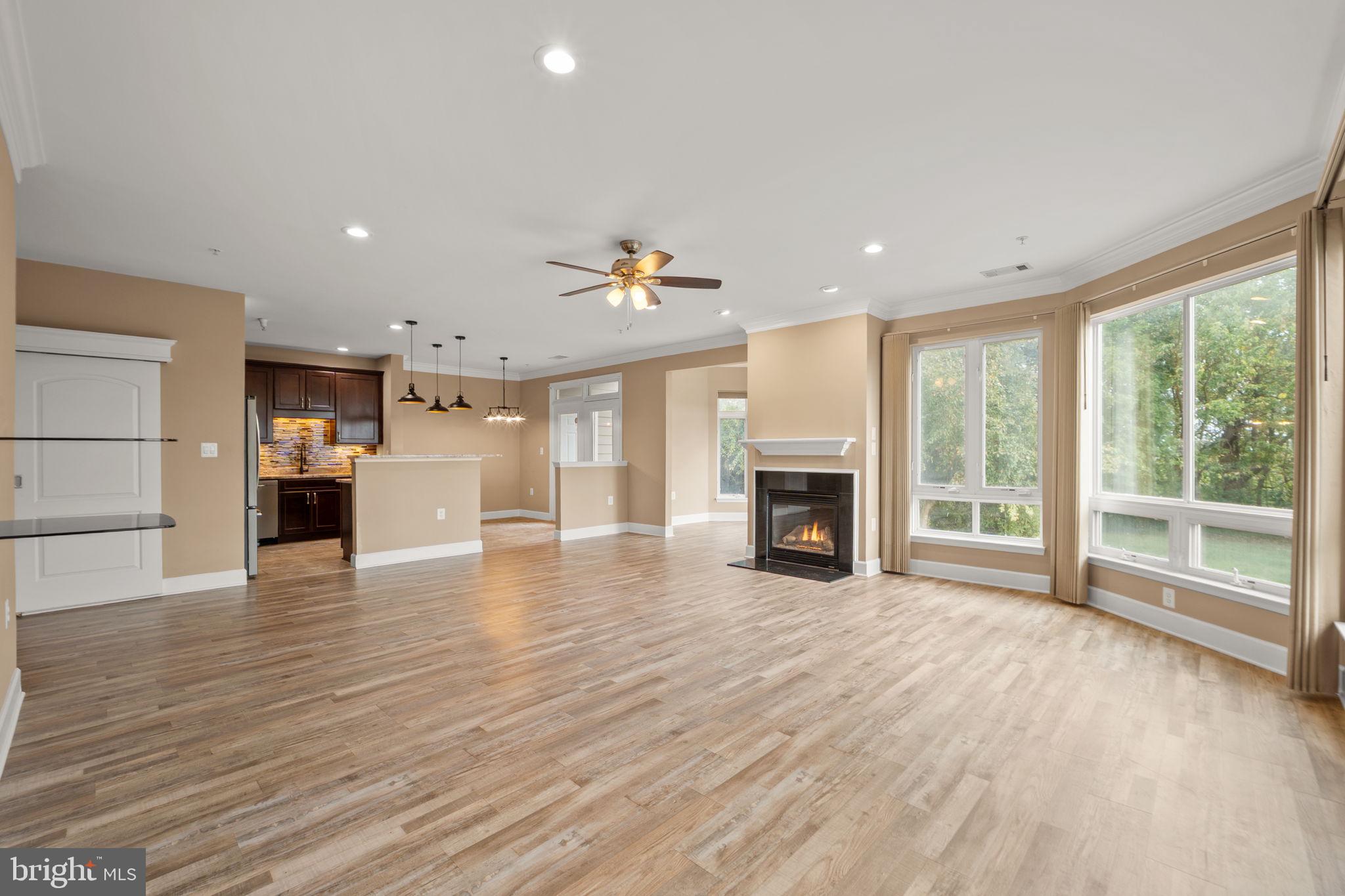 1621 Ladue Court, Unit 105 Woodbridge, VA 22191 - Photo 10 of 60 a view of a livingroom with a fireplace wooden floor and window