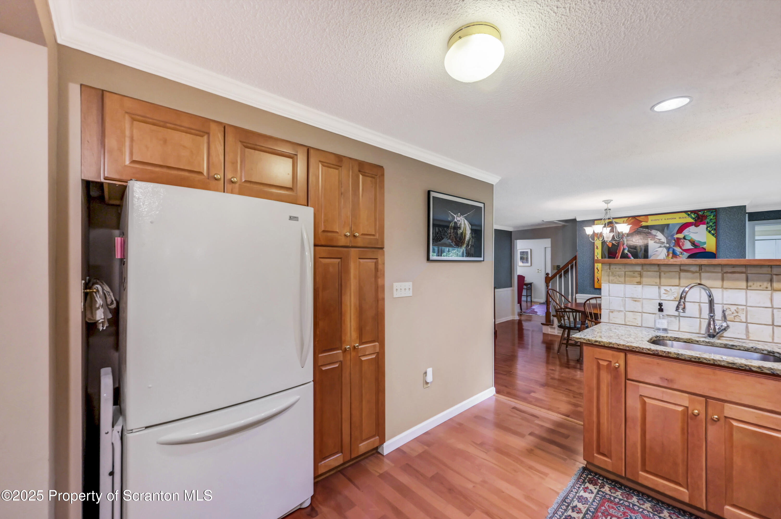 353 Benton Road Dalton, PA 18414 - Photo 16 of 78 a kitchen with stainless steel appliances granite countertop a refrigerator and a sink