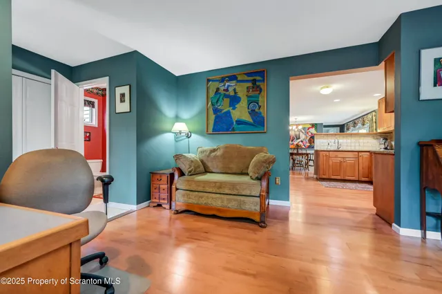 a living room with furniture and a lamp
