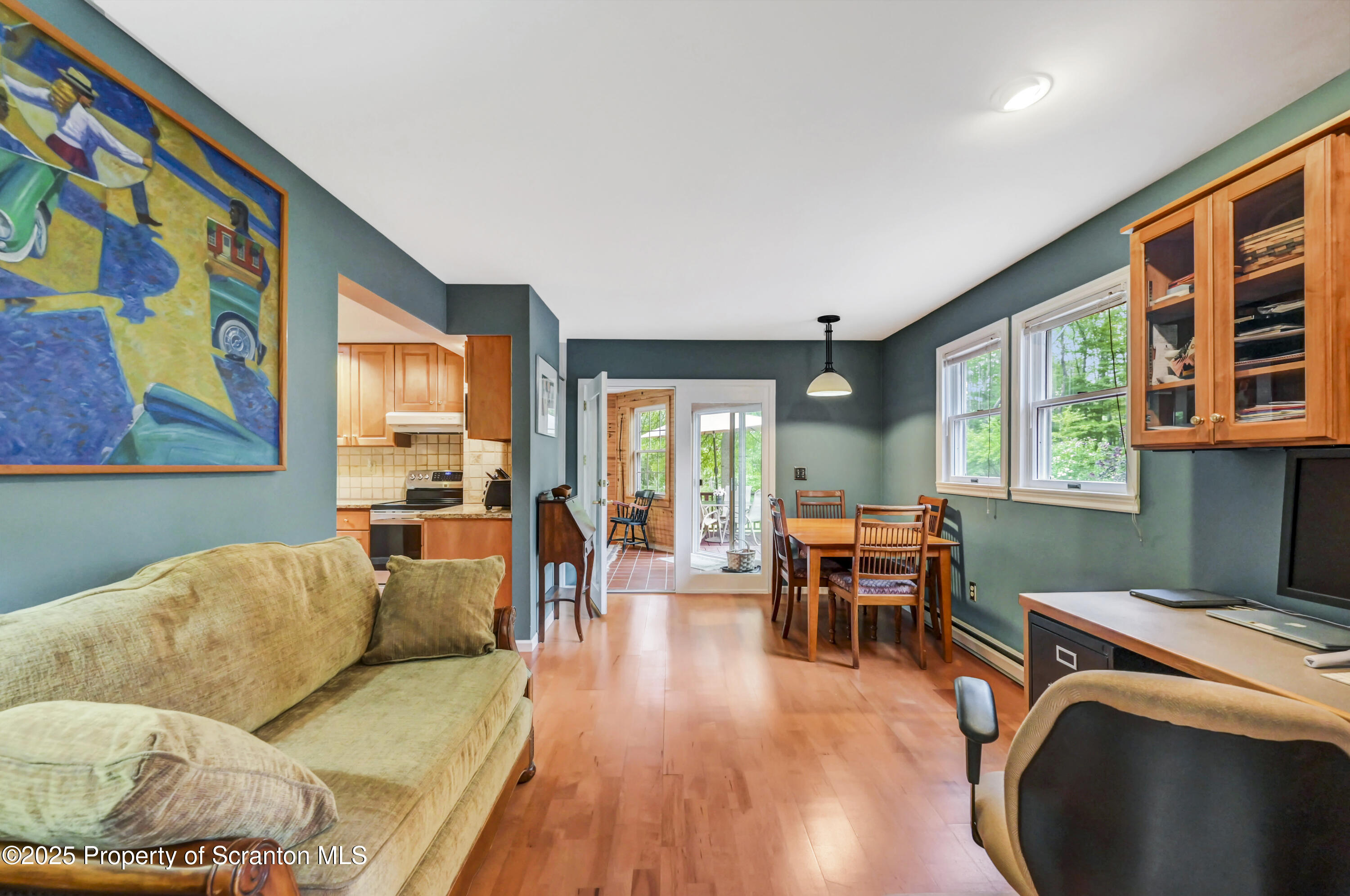 353 Benton Road Dalton, PA 18414 - Photo 20 of 78 a living room with furniture and floor to ceiling windows
