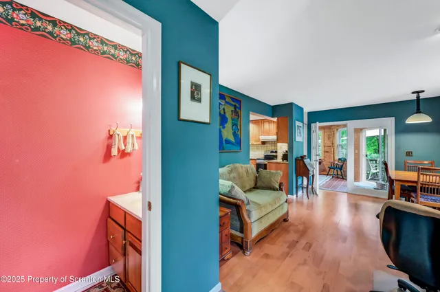 a bedroom with a bed and a lamp on dresser