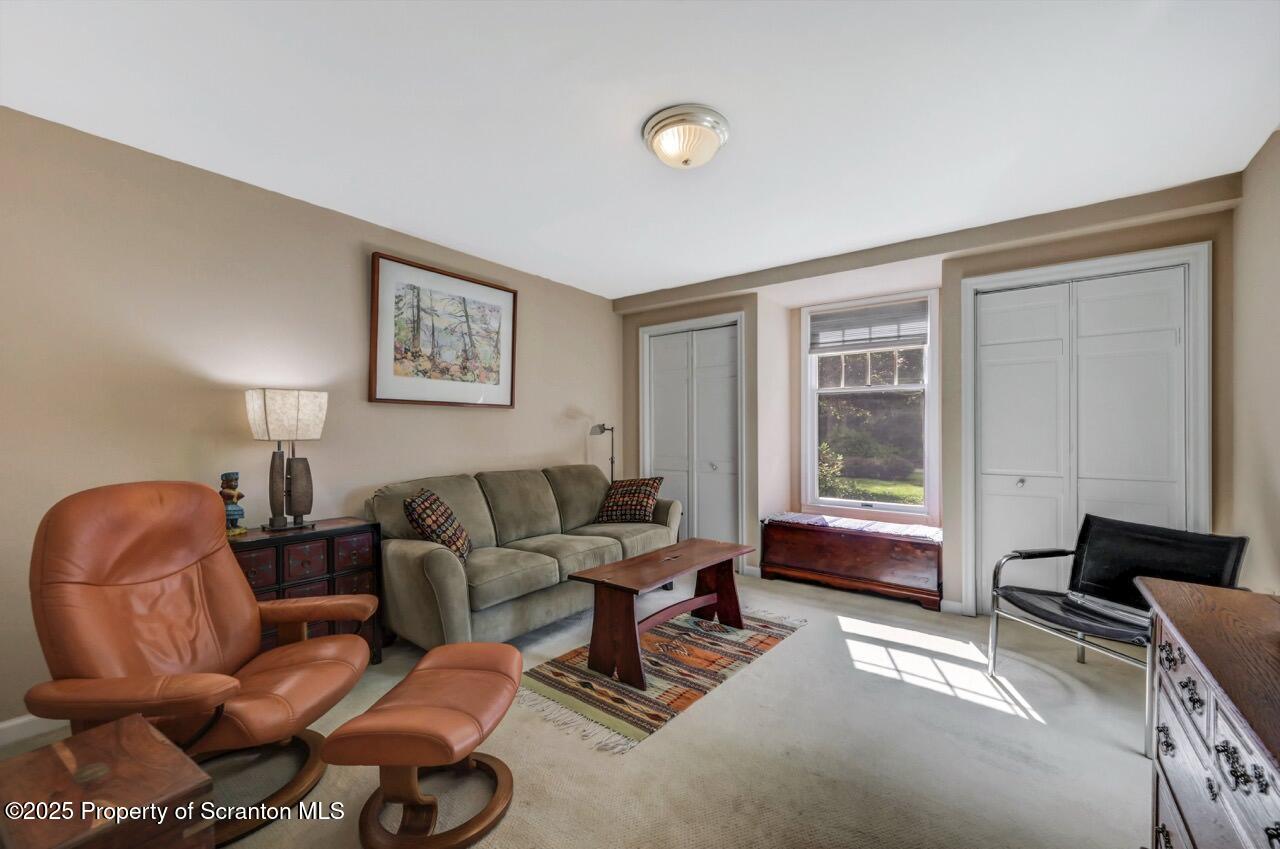 353 Benton Road Dalton, PA 18414 - Photo 26 of 78 a living room with furniture and a window