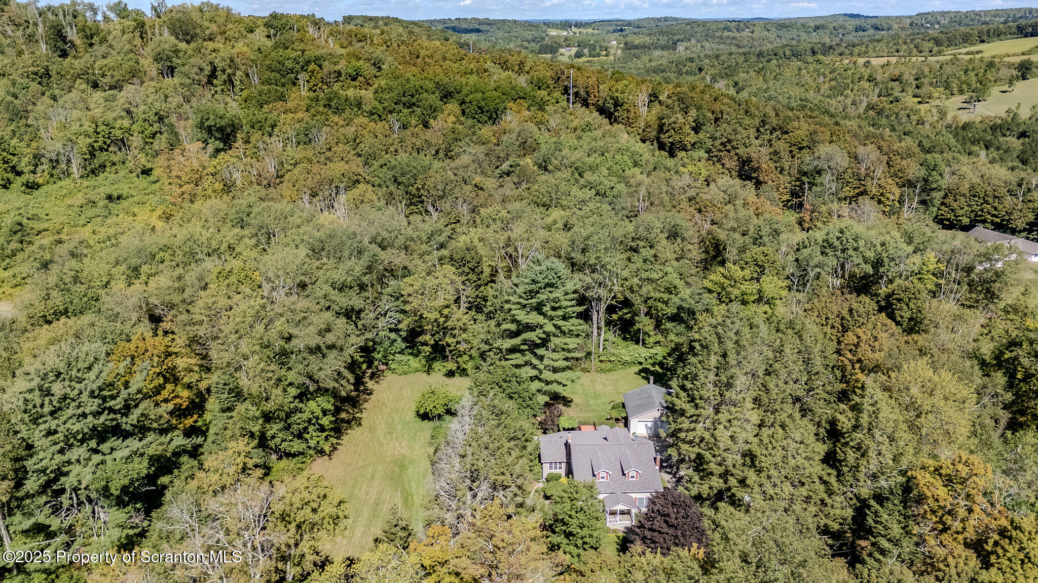 353 Benton Road Dalton, PA 18414 - Photo 3 of 78 an aerial view of residential house with outdoor space and trees all around