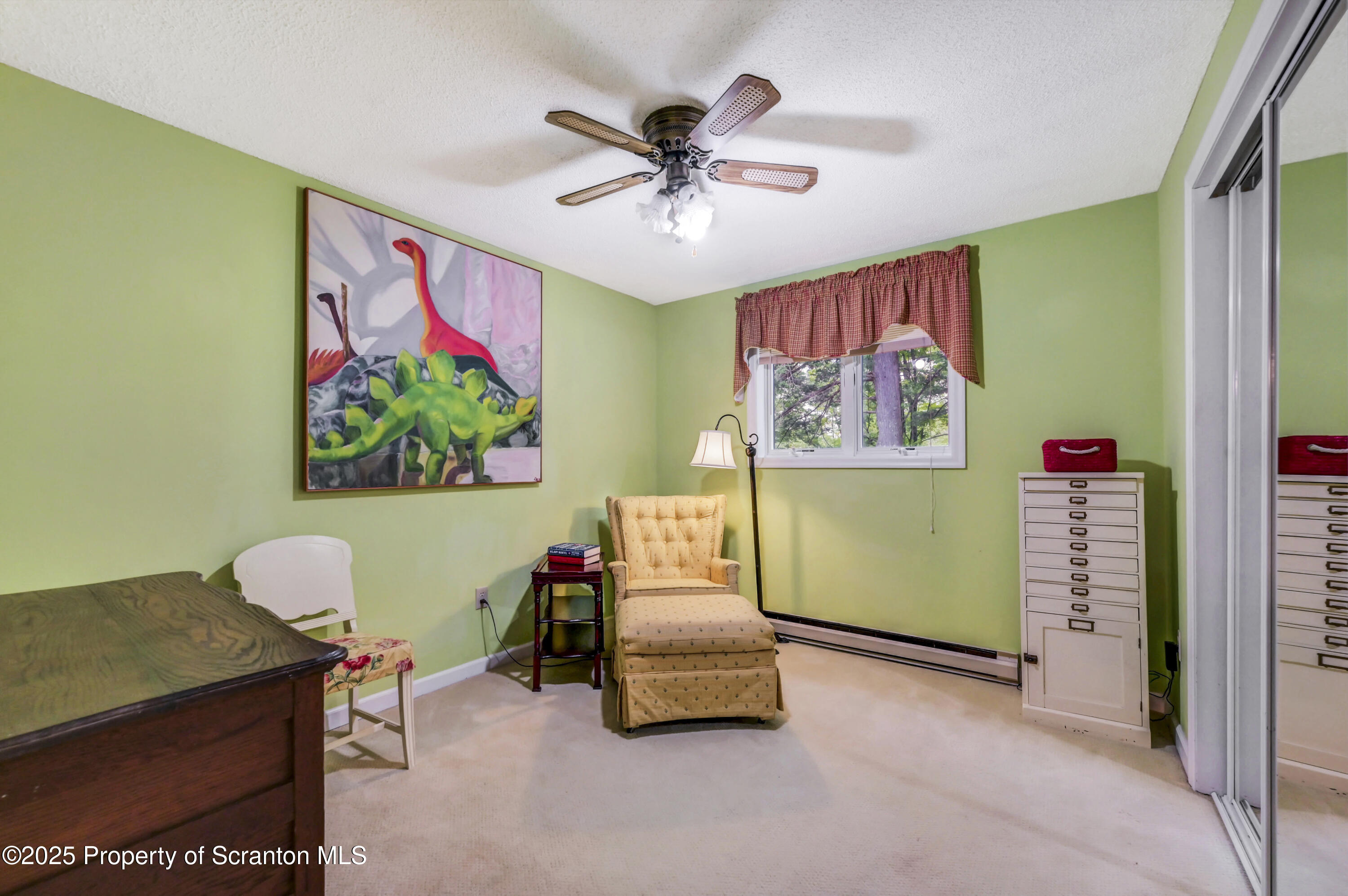353 Benton Road Dalton, PA 18414 - Photo 36 of 78 a living room with furniture and a chandelier