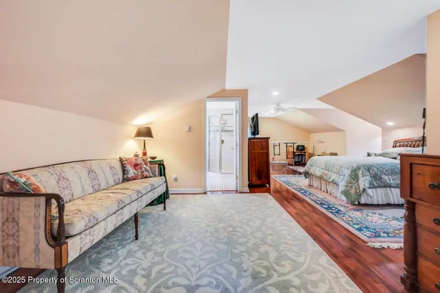 a backyard of a house with deck and outdoor seating