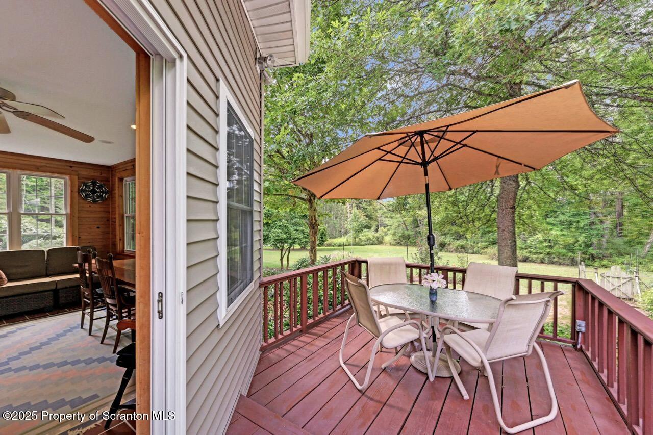 353 Benton Road Dalton, PA 18414 - Photo 51 of 78 a view of a patio with furniture and umbrella