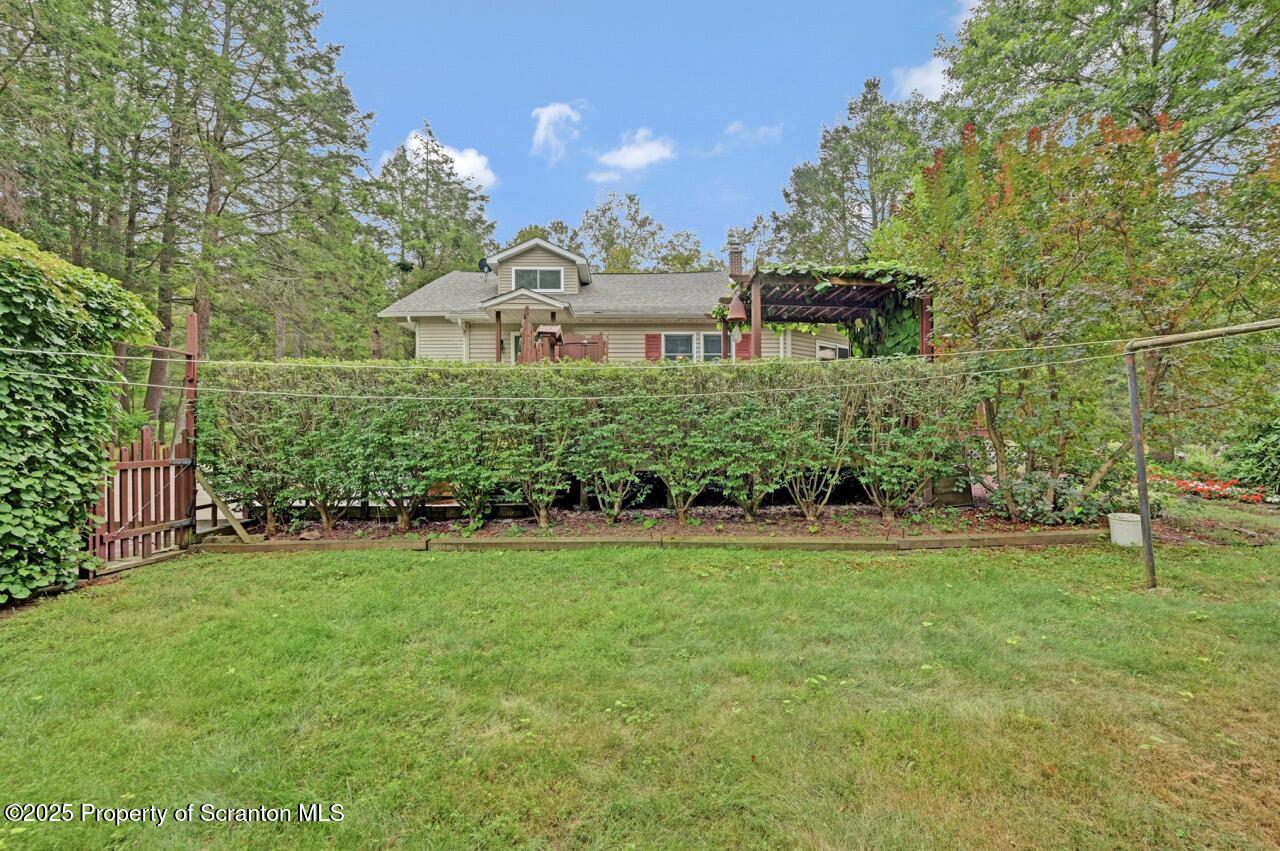 353 Benton Road Dalton, PA 18414 - Photo 62 of 78 a view of a big house with a big yard and large trees
