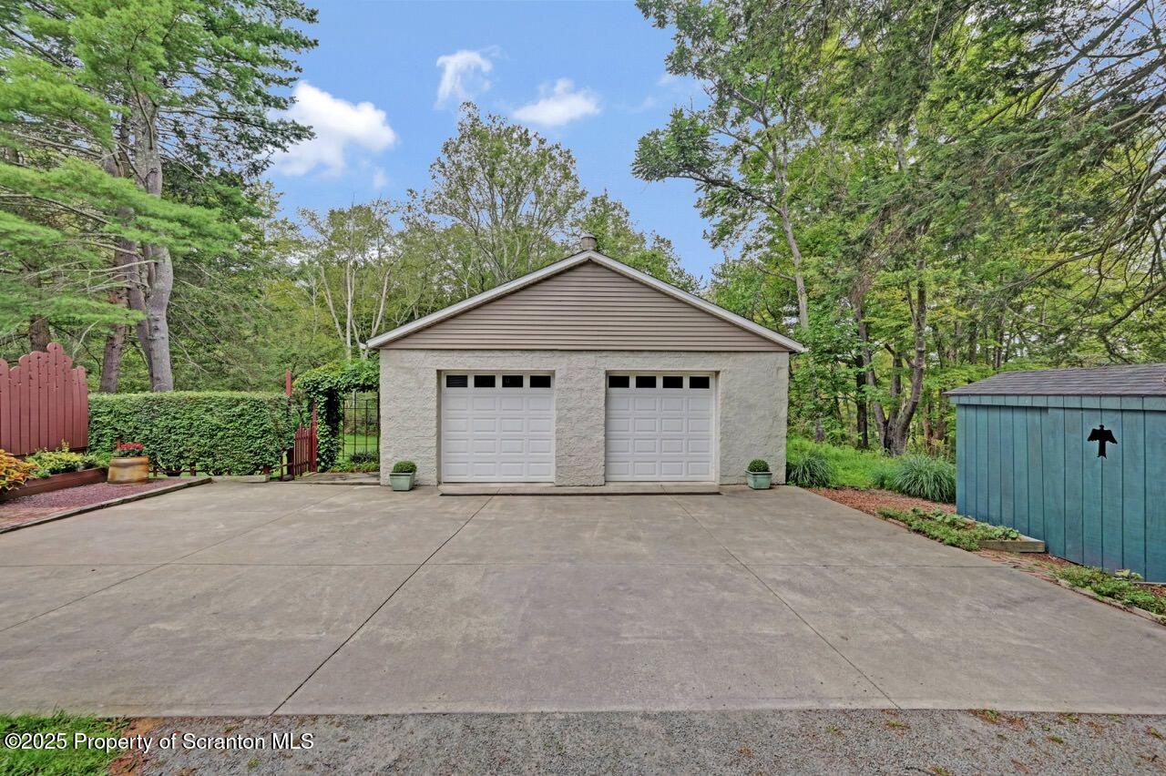 353 Benton Road Dalton, PA 18414 - Photo 66 of 78 a front view of a house with a yard and garage