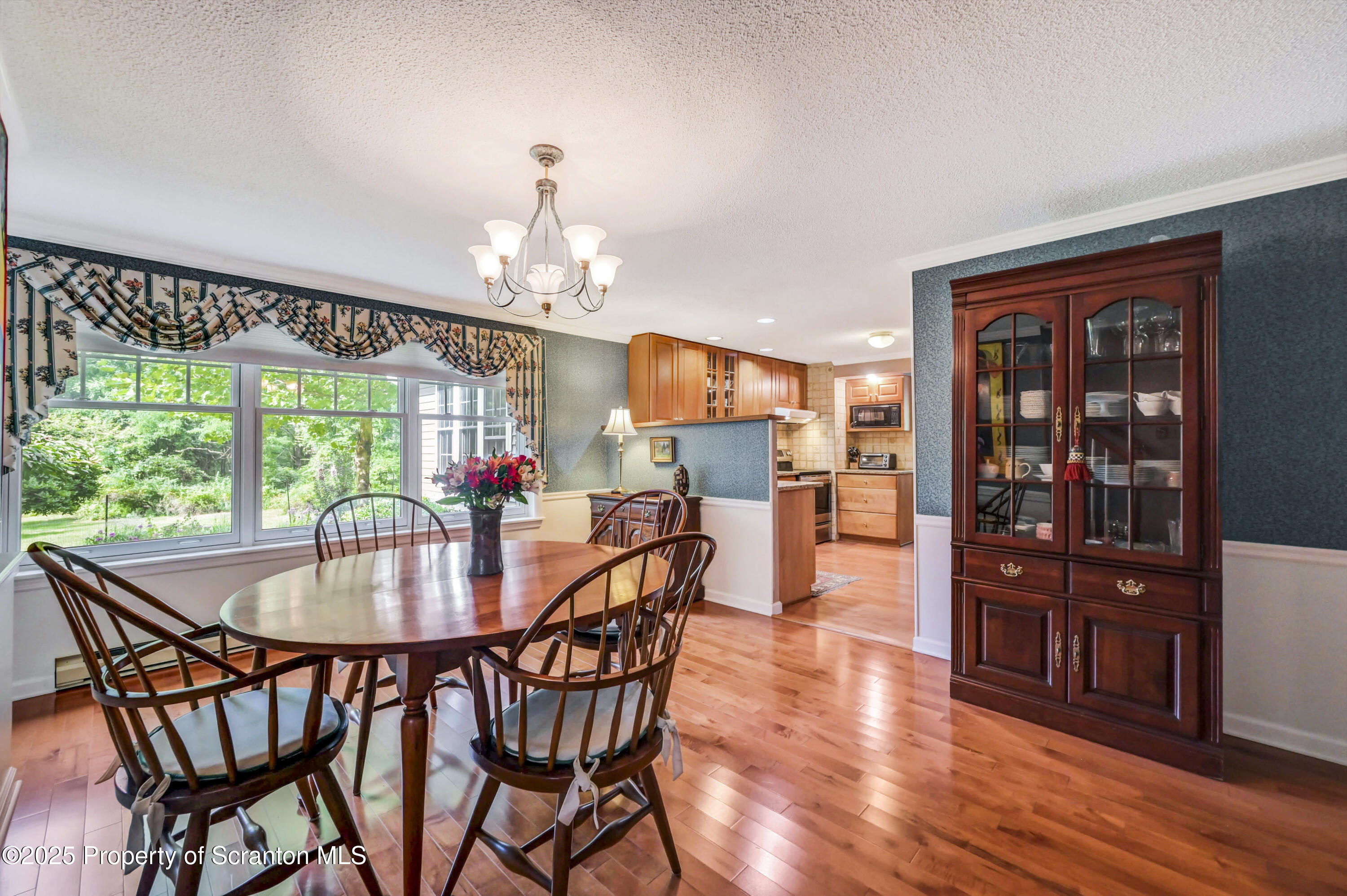 353 Benton Road Dalton, PA 18414 - Photo 8 of 78 a view of a dining room with furniture window and wooden floor