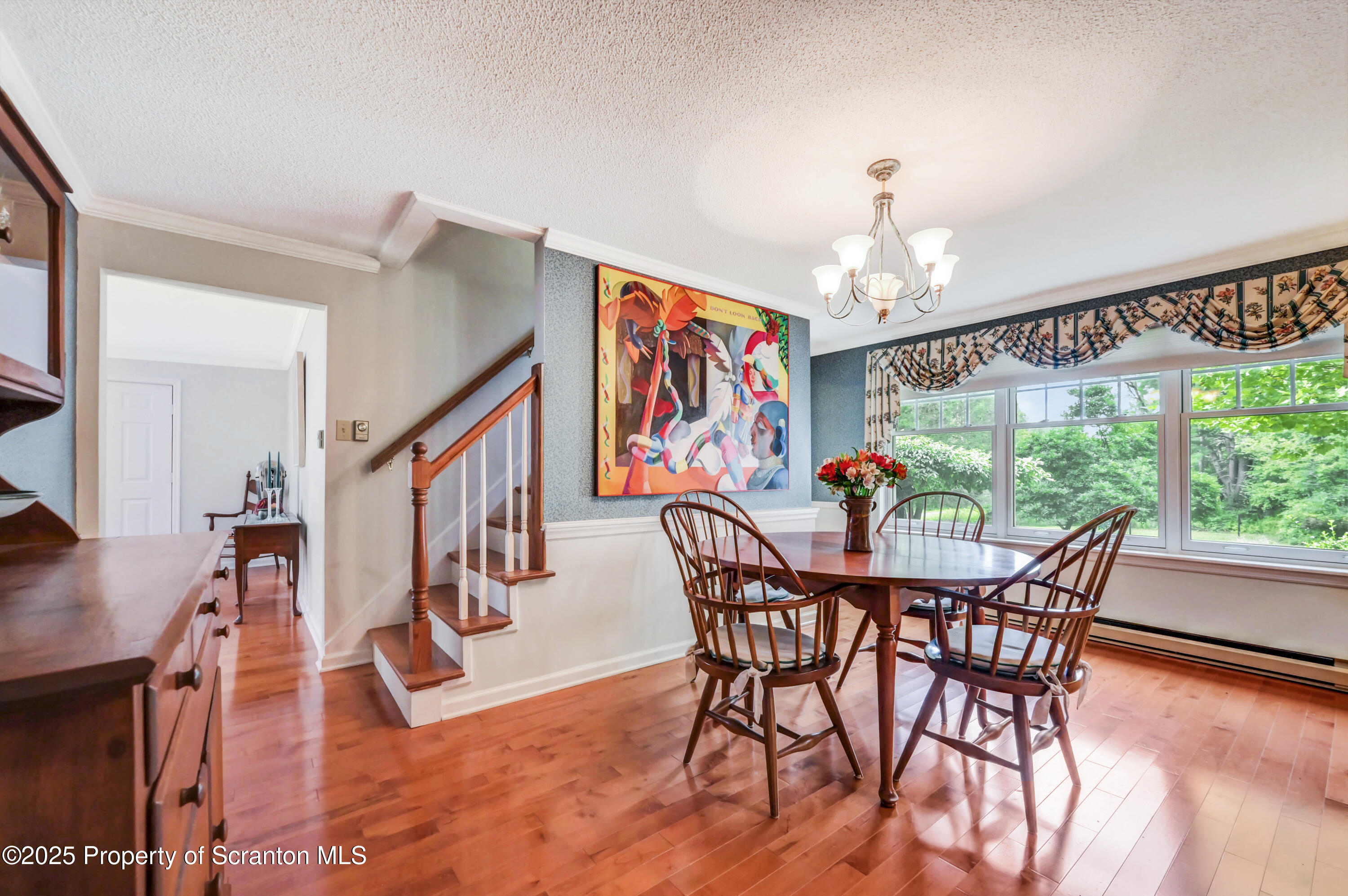 353 Benton Road Dalton, PA 18414 - Photo 9 of 78 a view of a dining room with furniture wooden floor and a chandelier