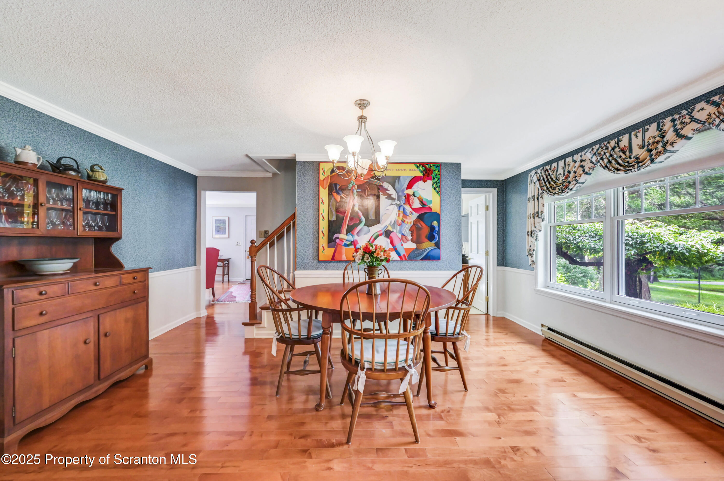 353 Benton Road Dalton, PA 18414 - Photo 10 of 78 a dining room with furniture a chandelier and wooden floor
