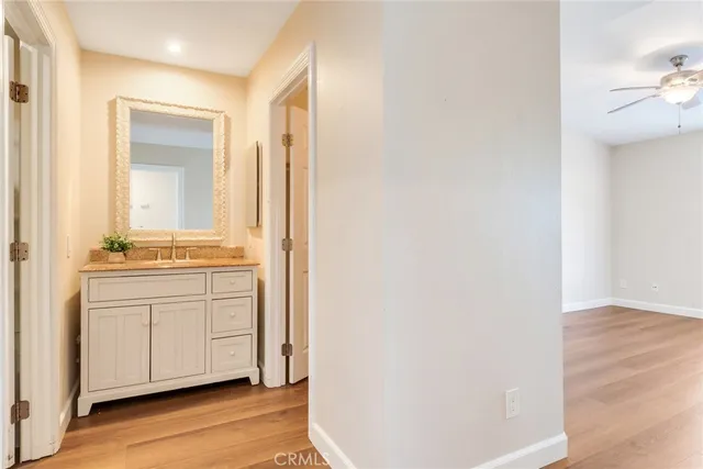 a room with a sink and a mirror