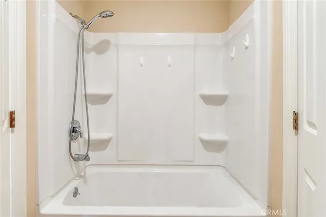 a bathroom with a bath tub