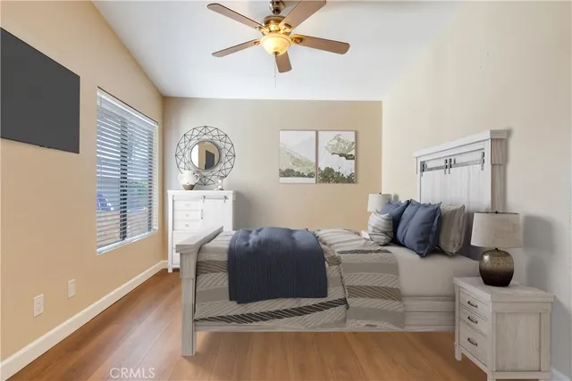 a bedroom with a bed and window